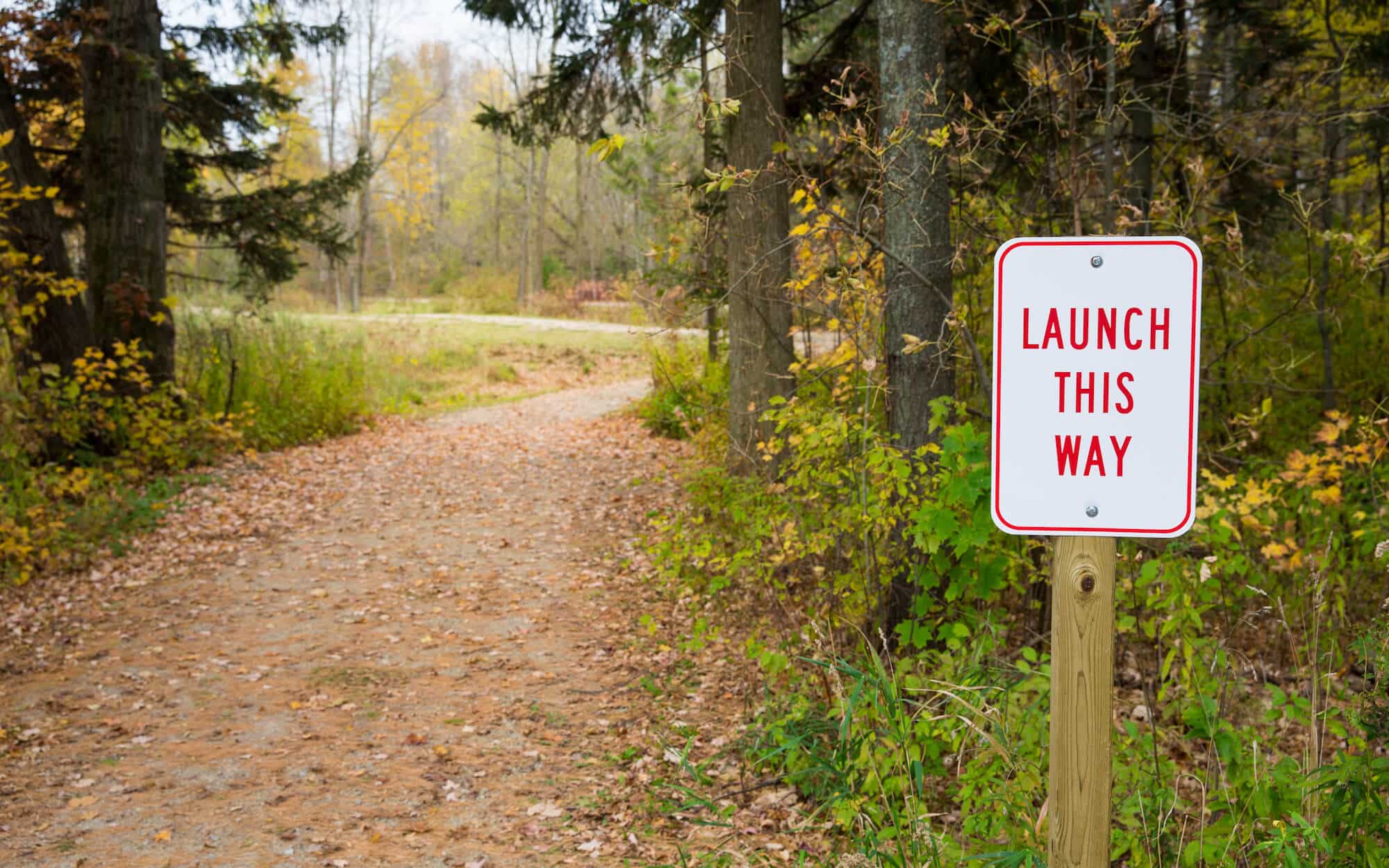 Banner image of wooded path for Product Launch Checklists blog